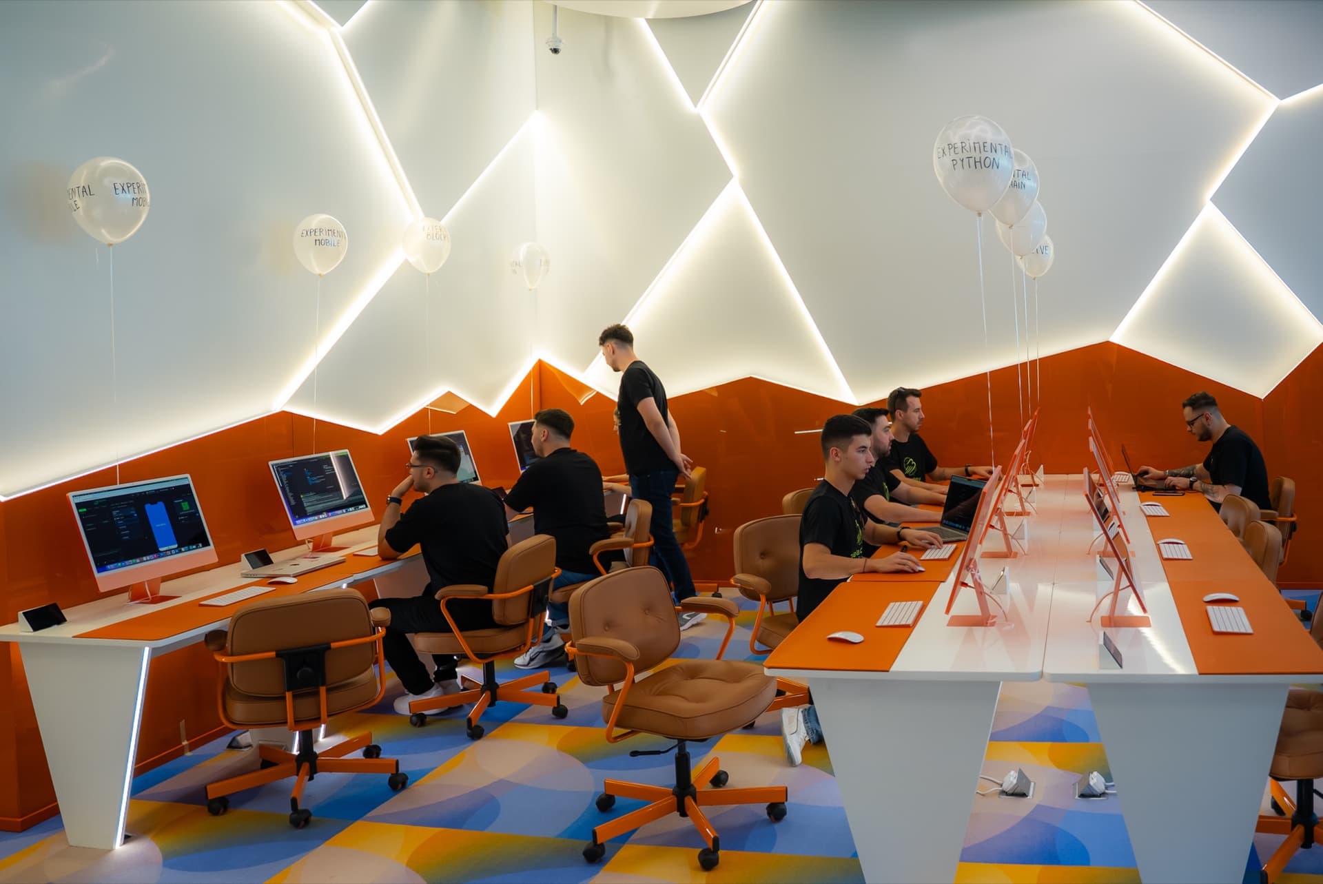 Students at work on the institute's classroom floor in Dubai
